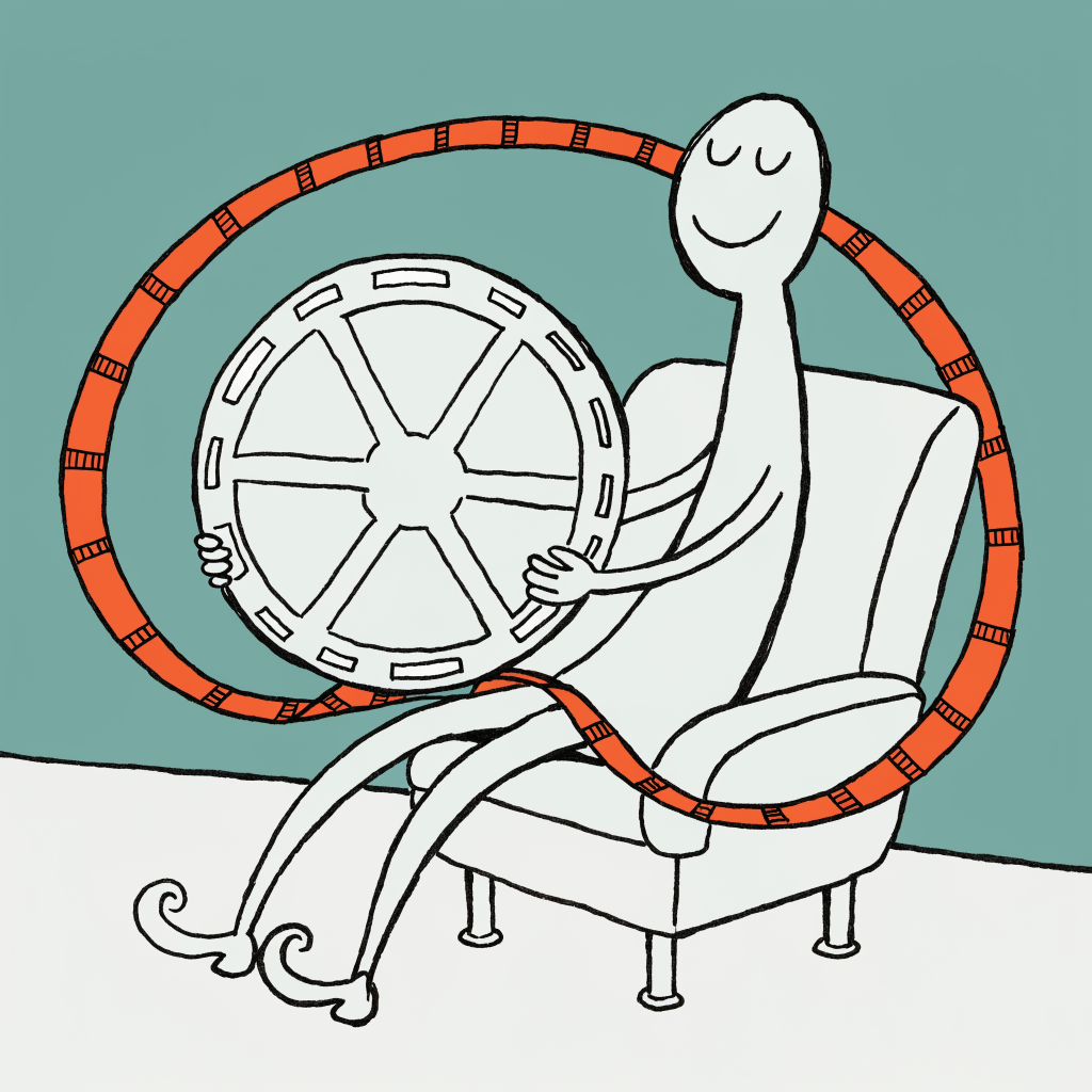 A film reel with a ribbon of film curling out of it, beside a theatre mask