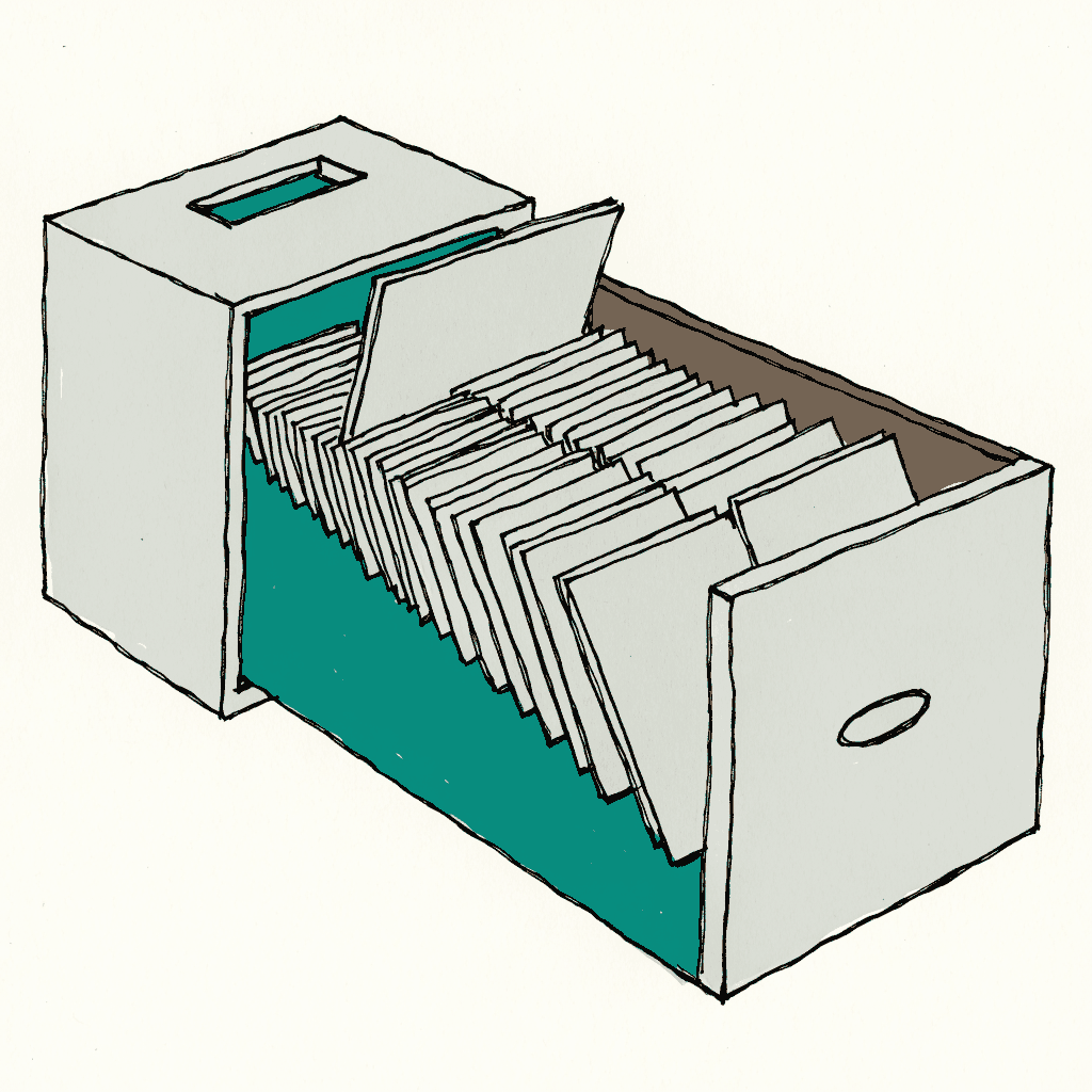 A card index drawer pulled open, full of blank filing cards