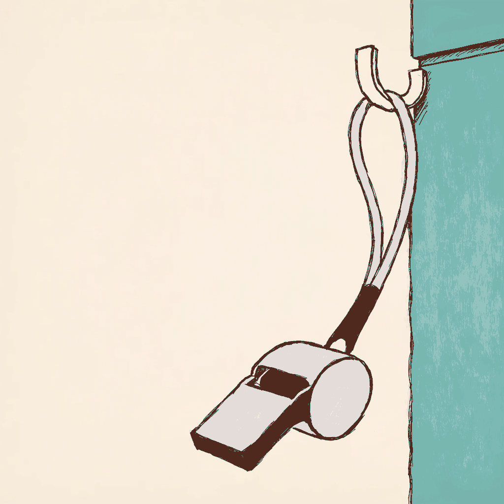 A referee's whistle on a lanyard hanging from a hook