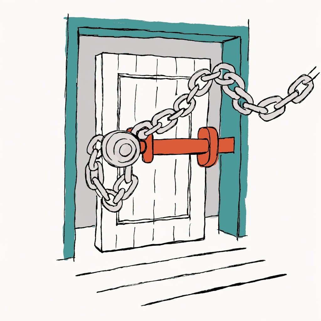 A heavy door closed with both a chain and a bolt across it