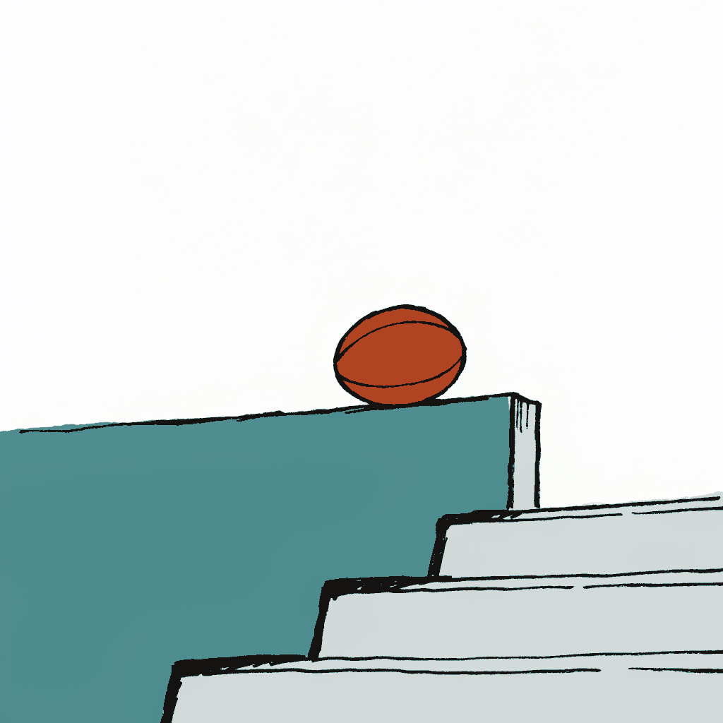 A football resting on an empty stadium terrace step