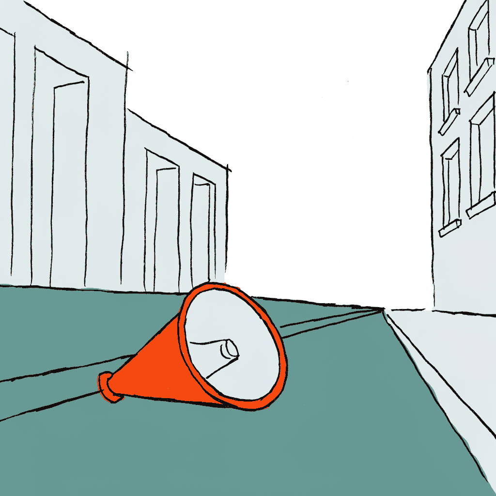 A megaphone lying on an empty city pavement
