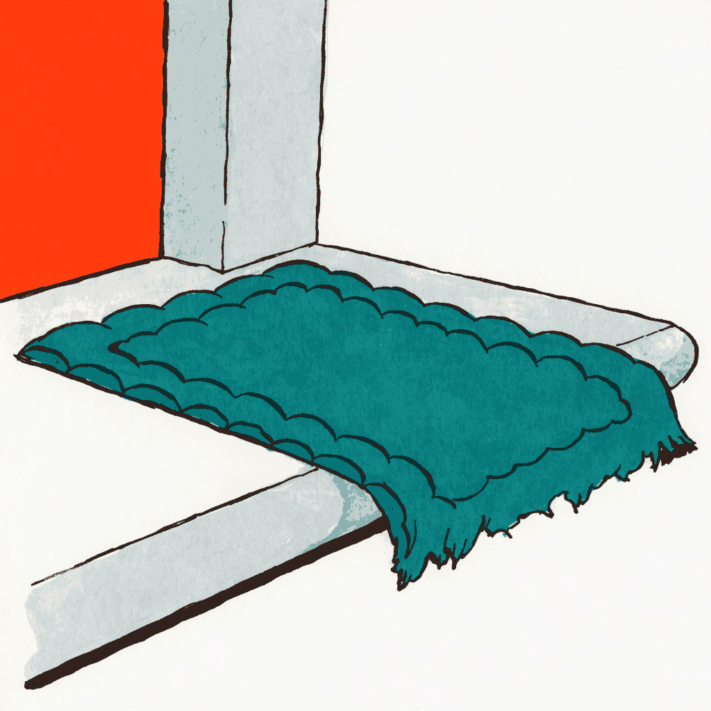 A doormat on a step with the welcome worn completely away