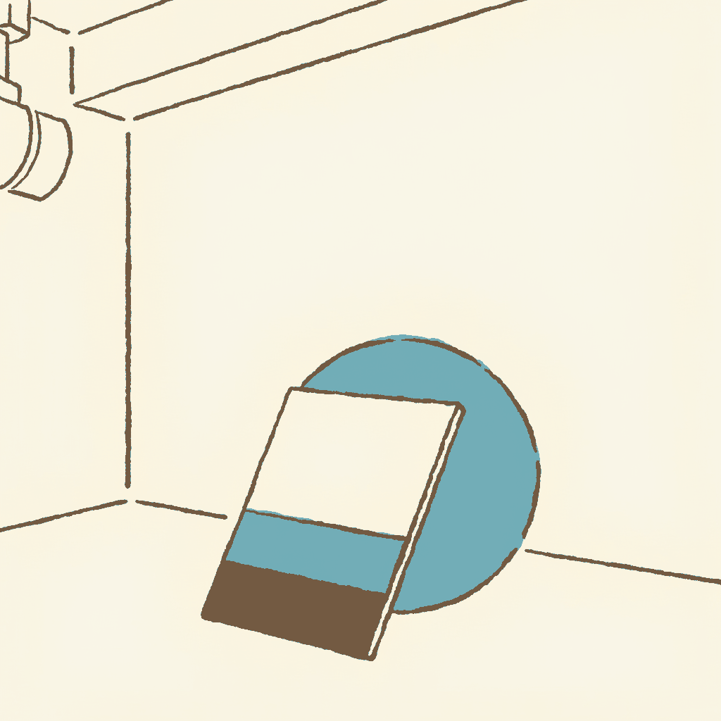 A printed credits card propped against a globe on an empty film set
