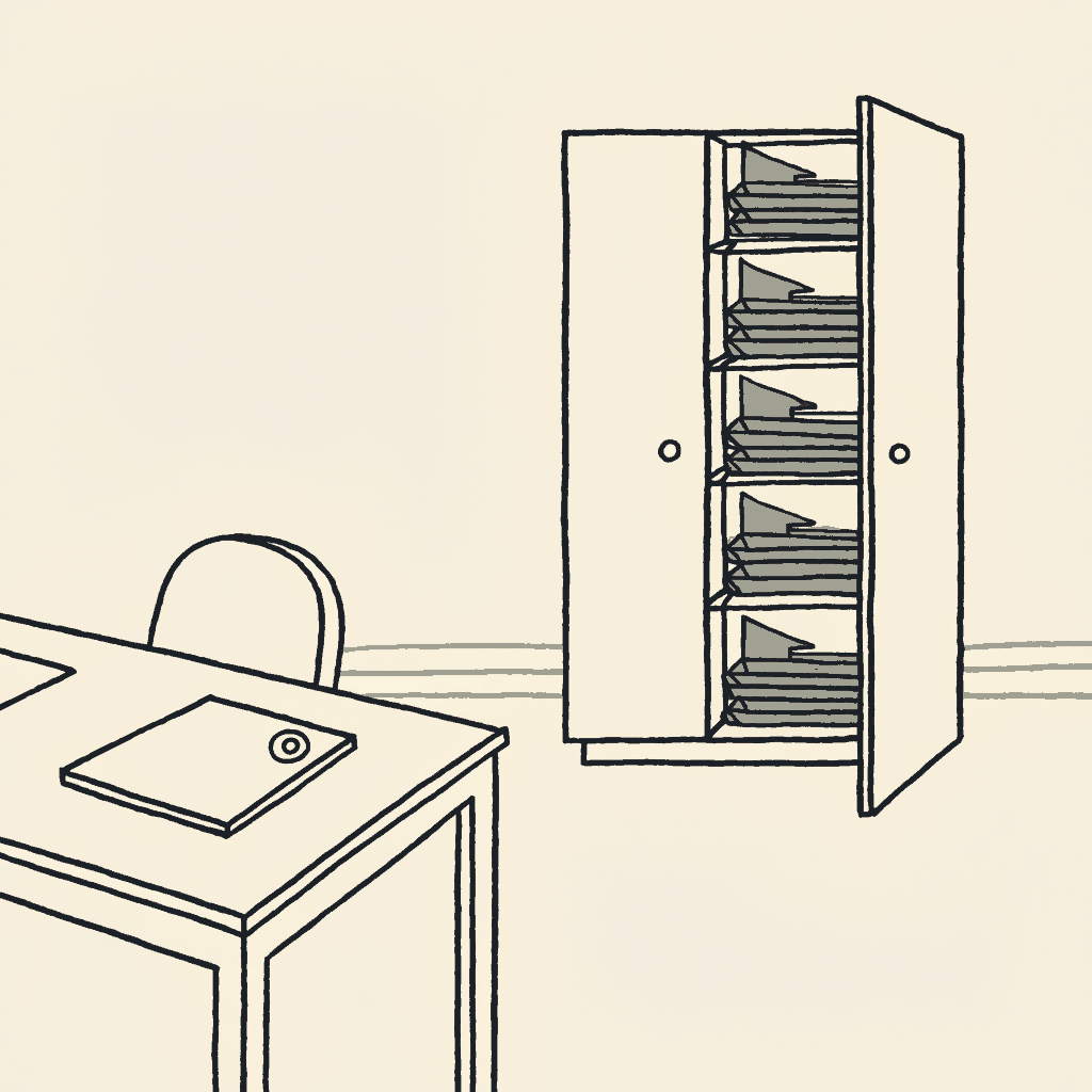 A plainly stamped file on an open desk while a cabinet of red-flagged folders stands ajar across the room