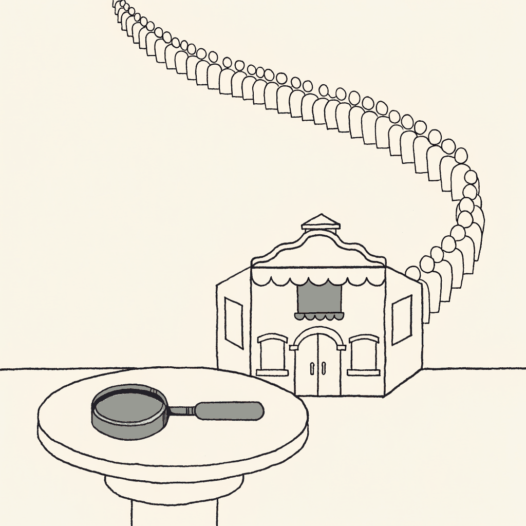 A magnifying glass resting on a table beside a tiny toy theatre with its ticket roll still full, and a long line of people winding away down the street behind